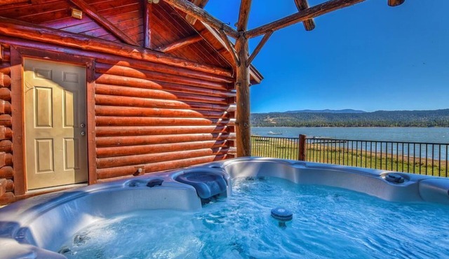 Beautiful lakefront estate, hot tub, 180-degree views, game room, and BBQ grill!