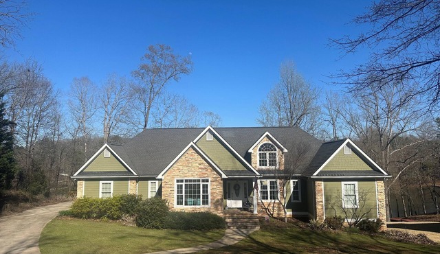 Beautiful lakefront home on over an acre with lots of room, views, and amenities