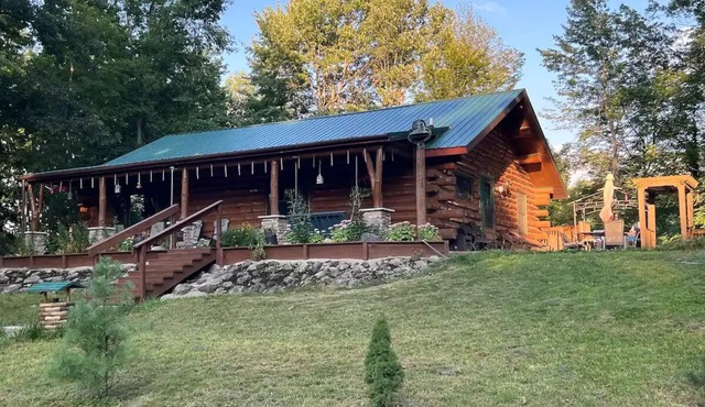 Beautiful Log Cabin 11ac. 4 br. 2.5 ba. on snowmobile trails in Manistee forest.