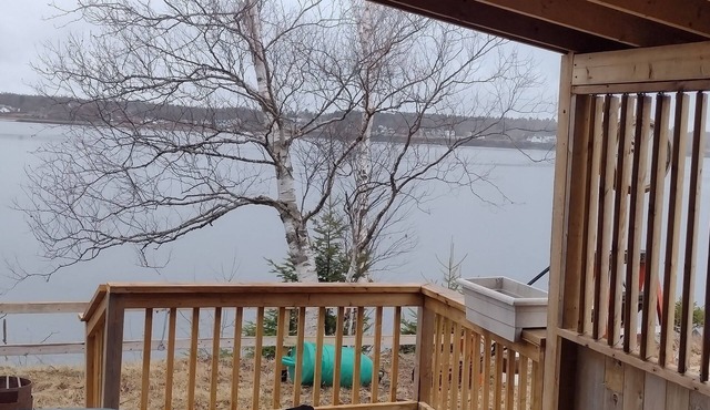 Beautiful location right on the river bank , steps down to the shore and fishing