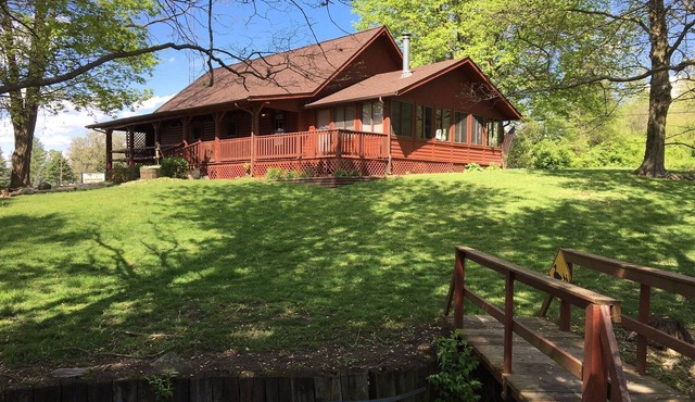 Beautiful Lofted Home with Rugged Wood Interior Featuring Large Beams