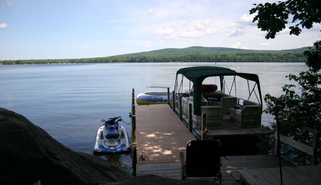 Beautiful log cabin on clear serene Province Lake with private beach.