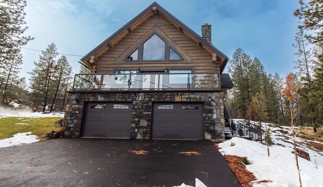 beautiful log home that is located on silver lake.