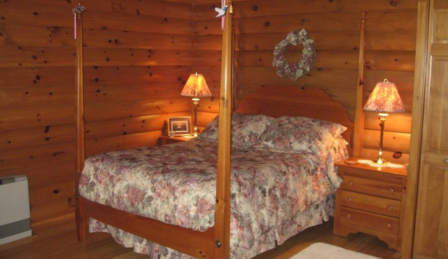 Beautiful log sided, on Owasco Lake w/private beach, entrance and parking.