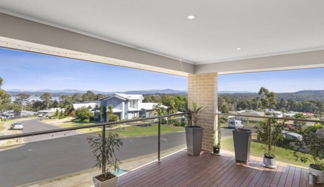 Beautiful modern, upstairs apartment with stunning water and mountain views.