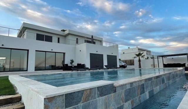 Beautiful new housse with splendid view and big pool.