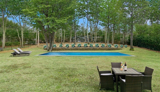 Beautiful Peconic Bay home with water views, private pool, wraparound front...