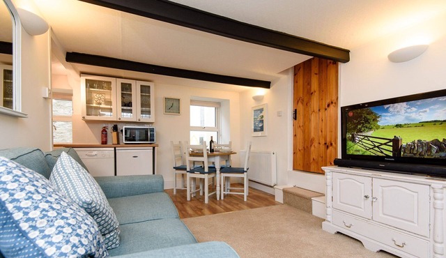 Beautiful property in the heart of Looe, yards from the beach with reserved parking space.