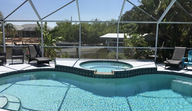 Beautiful relaxing waterfront home with pool, spa and boat dock.