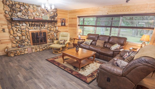 BEAUTIFUL RETREAT HOME ON 2 FENCED PRIVATE ACRES. WALK TO FOREST AND GOLF!