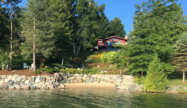 Beautiful sloping view to water's edge on this Lake Charlevoix South Arm escape.