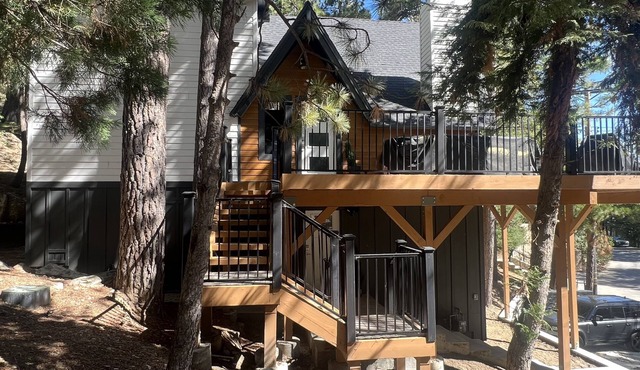 Beautiful updated 3 level home with high ceilings, a wall of windows & game room