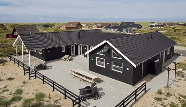 Beautiful vacation home with indoor pool and large activity room near Harboøre.