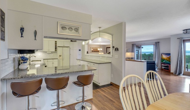 Beautiful views of Little Traverse Bay and a spacious wraparound deck