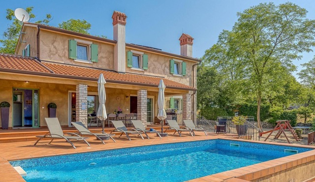 Beautiful villa with swimming pool surrounded by a natural fence