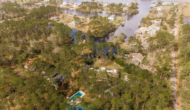 Beautiful waterfront paradise with water access, pool, tennis court.