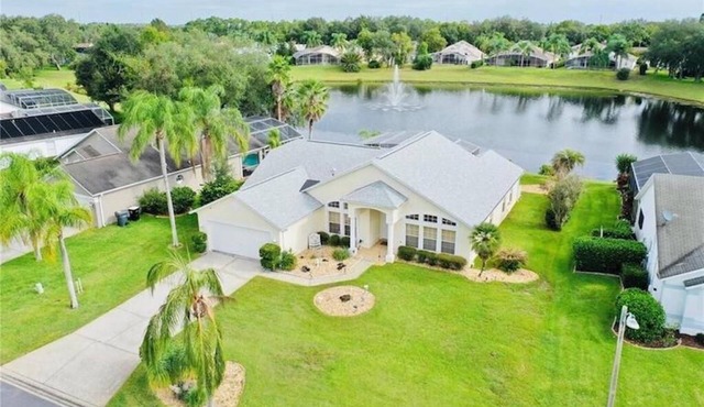 Beautiful waterfront home with heated pool and game room.