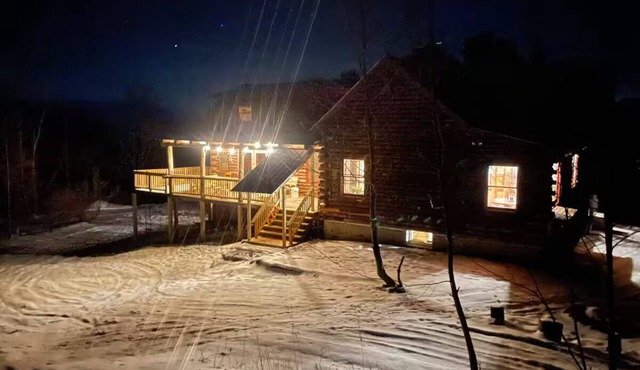 Beautiful Wintry Log Cabin Immersed in Nature