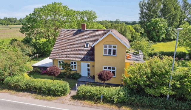 Beautiful yellow country villa by the water