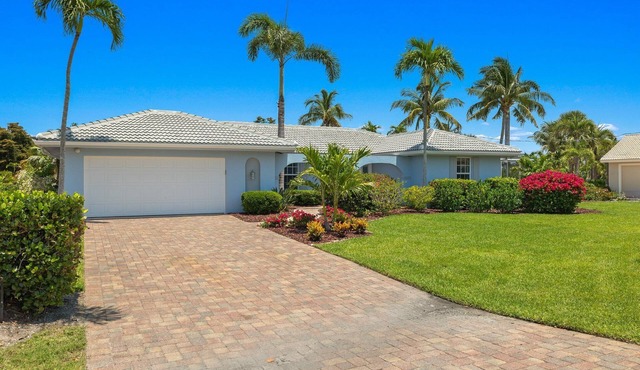 Beautifully newly redesigned canal front pool home minutes to beach! NEW!