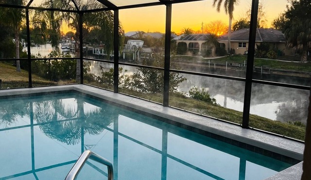 Beautifully updated home on canal with heated pool - no additional charge.