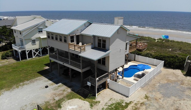 Become an AQUAHOLIC in this oceanfront, dog friendly home on Oak Island!