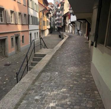 Bedroom cum office with shared shower in Zug's Old Town