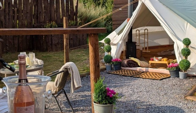 Bell tent in ultimate luxury with a wood fired hot tub, super king size bed