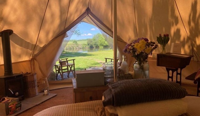 Bell tent in ultimate luxury with a wood fired hot tub, super king size bed