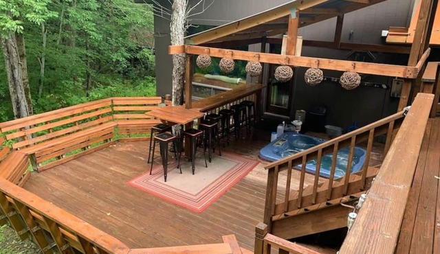 Best of both worlds; chalet located on a private lot in the woods and only 3 miles from the village!