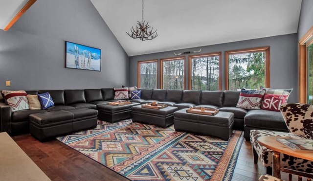 Best of both worlds; chalet located on a private lot in the pines and only 1 miles from the village!