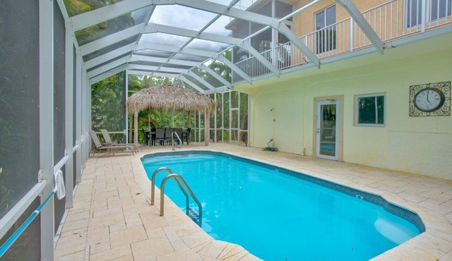 Big Kahuna an expansive and inviting 5-bedroom, 4-bathroom single-family haven that encapsulates the essence of Florida Keys living