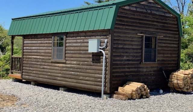 Big Mike's Cabin on the lake, next to ball diamonds nestled in 3 -cabin village