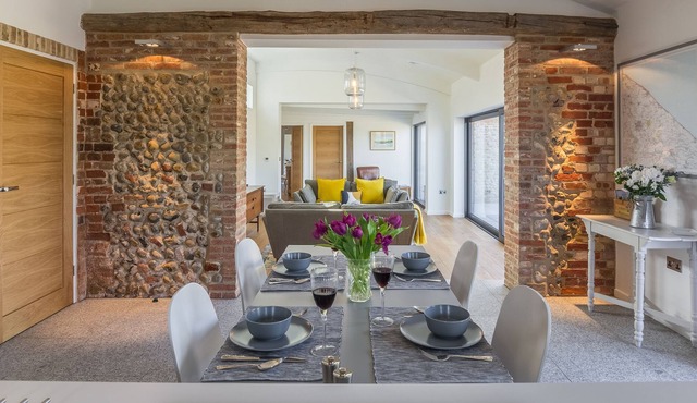 Big Sky Barn is a contemporary conversion of a 200 year old brick and flint barn