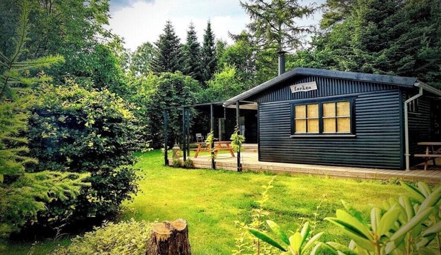 Black wooden house with annex near Stubbe Sø