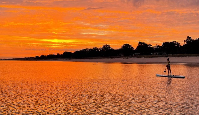 Blocks from the beach with giant covered deck, firepit, and grill!