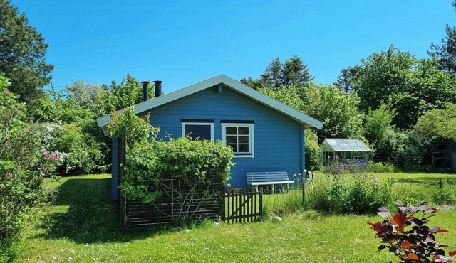 Blue cottage on idyllic Askø