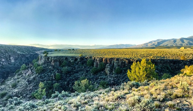 Bordering the Rio Grande Del Norte National Monument is a home on the Mesa