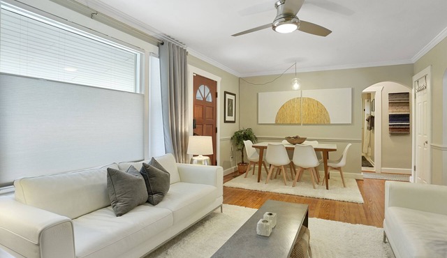 Boutique style home with original works of art on a gorgeous tree lined street.