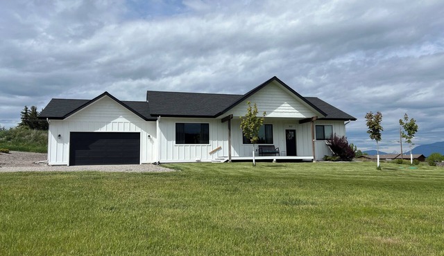 Brand new house with deck and amazing views on large country lot close to town.