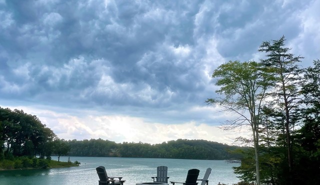 BRAND NEW Lake Front home. Private cove and boat dock! Modern farmhouse appeal!