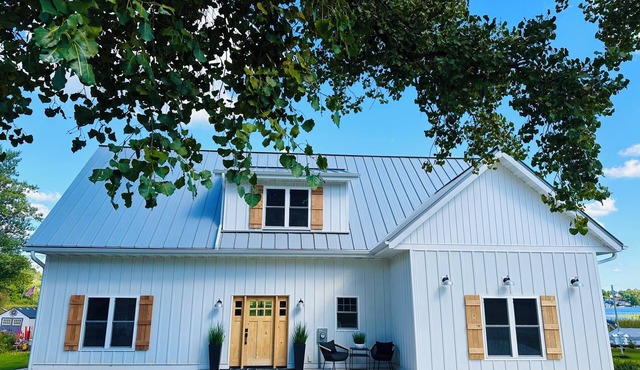 Brand new Modern, 6 bedroom waterfront home on a beautiful Long Lake.