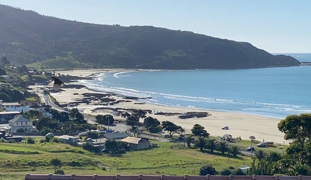 "Breakview" - quiet, comfortable bach with a spa pool, for families and surfers.