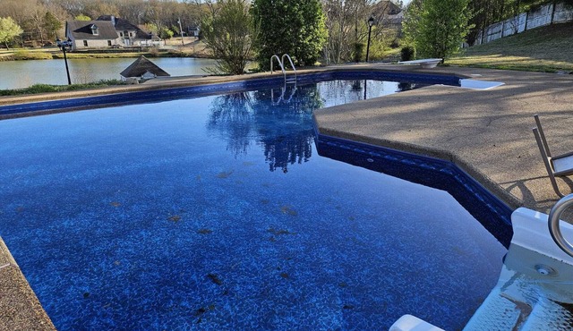 Breathtaking 8 BR Retreat with Private Pool, Lake View, & Expansive Backyard.