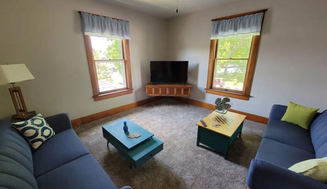 Breathtaking house steps from the river with incredible 1890s woodwork & floors