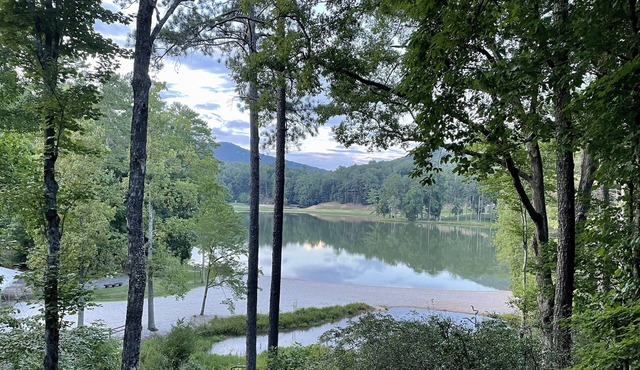 Breathtaking lake views, steps from beach, golf, and clubhouse. Renovated home!