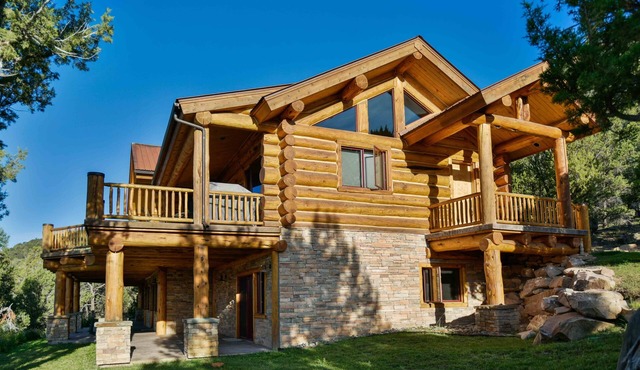 Breathtaking luxury log home on 44 acres. Two primary suites. STR-1-2024-053.