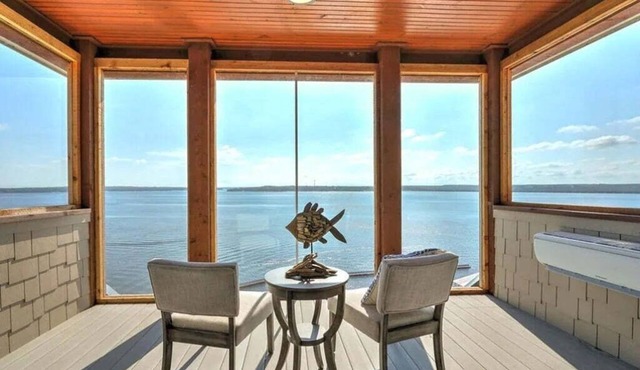 Breathtaking waterfront property with game room and 3 waterfront decks!