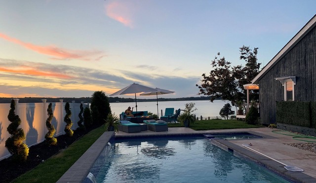 Breathtaking waterfront property with pool, private dock and open floor plan.