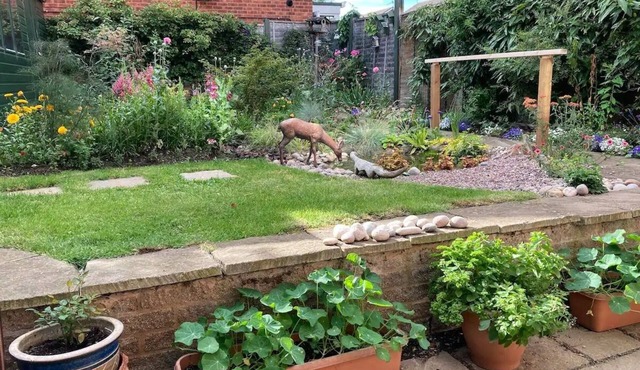 Bright an airy with a luxury Super King bed and a beautiful cottage garden.